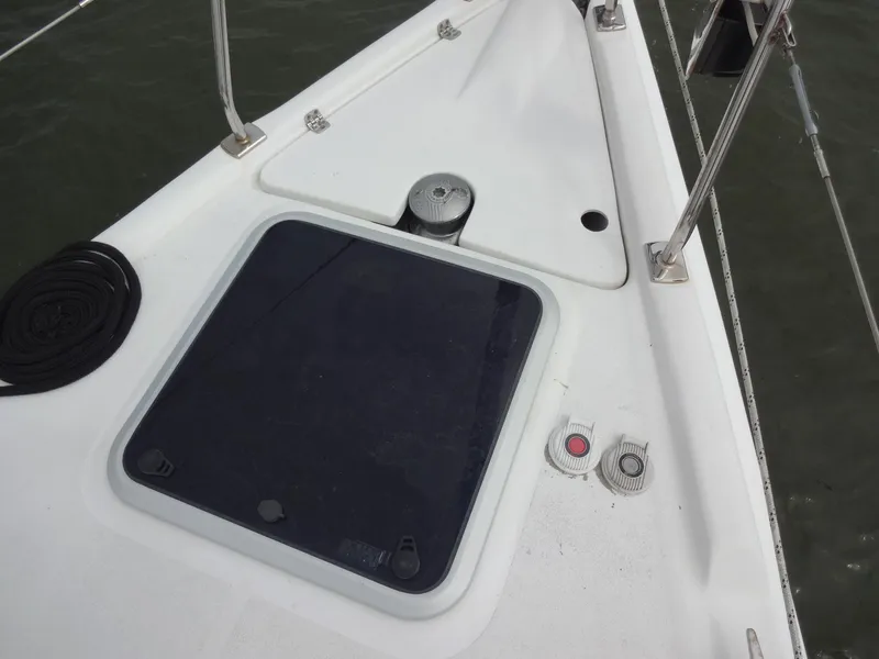 Slide: The Image of The image shows the deck of a 2009 Hunter 50 sailboat with a hatch and fittings. - 20