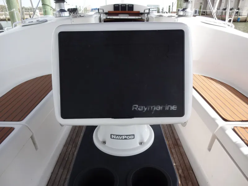 Slide: The Image of The cockpit of a 2009 Hunter 50 with a Raymarine display on a NavPod. - 11