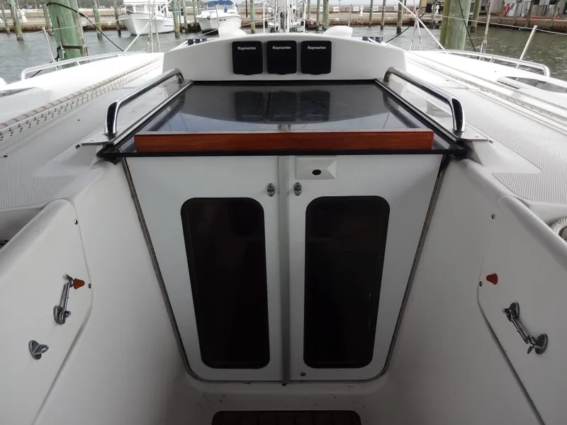 Slide: The Image of The image shows the cockpit of a 2009 Hunter 50 with a double door. - 29