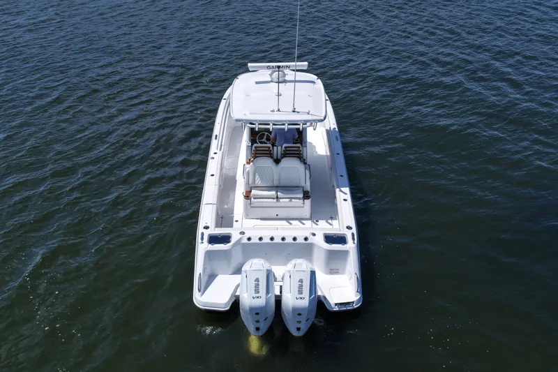 Slide: The Image of 2027 Everglades 315 Center Console boat on open water, aerial view. - 16