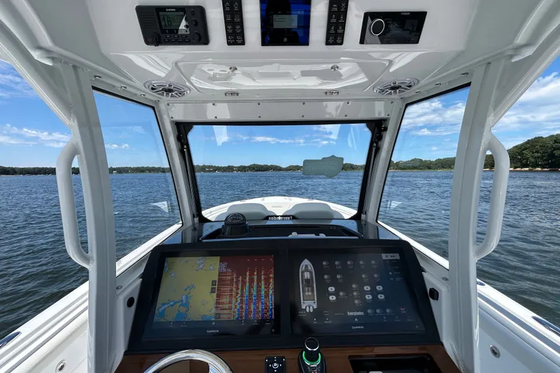 Slide: The Image of Interior view of 2027 Everglades 315 Center Console boat with advanced navigation system. - 26