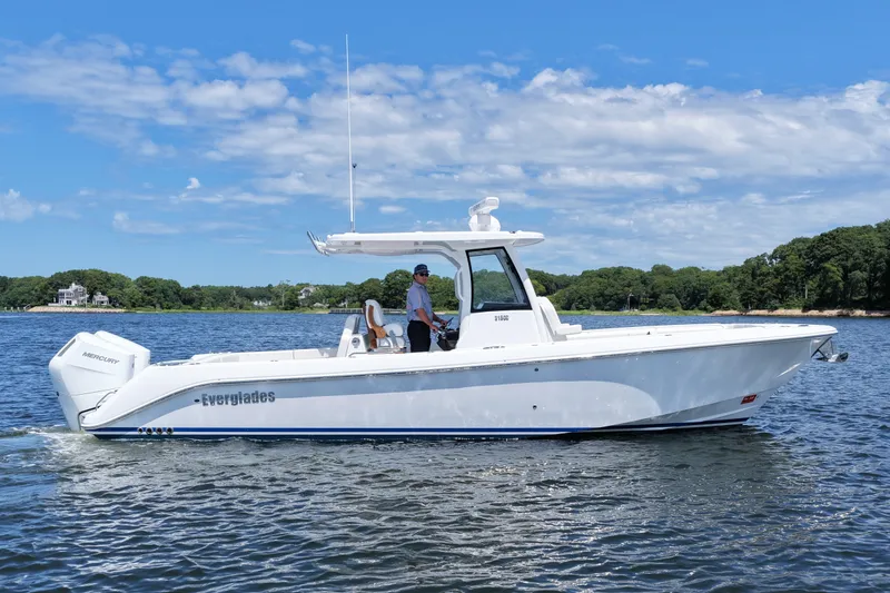 Slide: The Image of 2027 Everglades 315 Center Console boat cruising on a sunny day. - 4