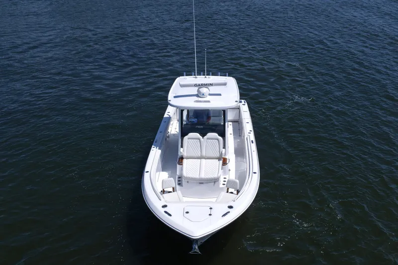 Slide: The Image of 2027 Everglades 315 Center Console boat on open water, aerial view. - 14