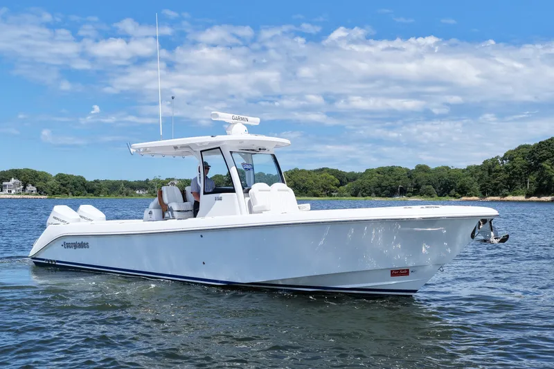 Slide: The Image of 2027 Everglades 315 Center Console boat cruising on a sunny day, featuring sleek design. - 3