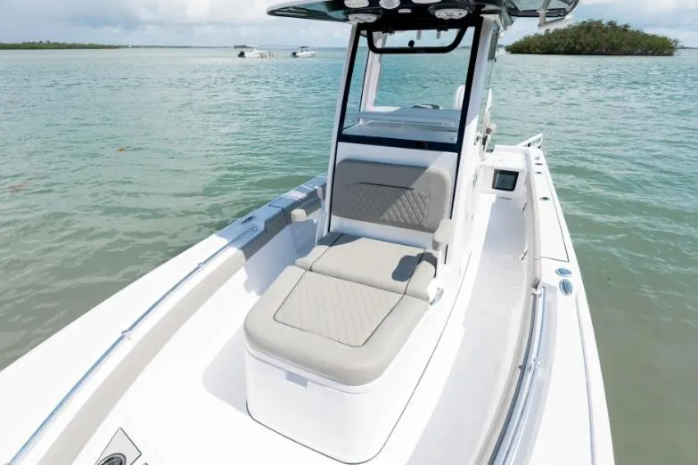 Slide: The Image of 2026 Sportsman Masters 247OE Bay Boat on calm waters, featuring sleek seating and modern design. - 4