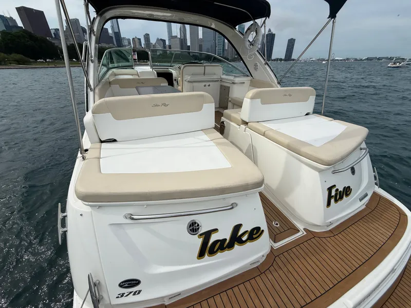 Slide: The Image of The image shows a 2013 Sea Ray 370 Venture with beige upholstery and wooden flooring. - 3