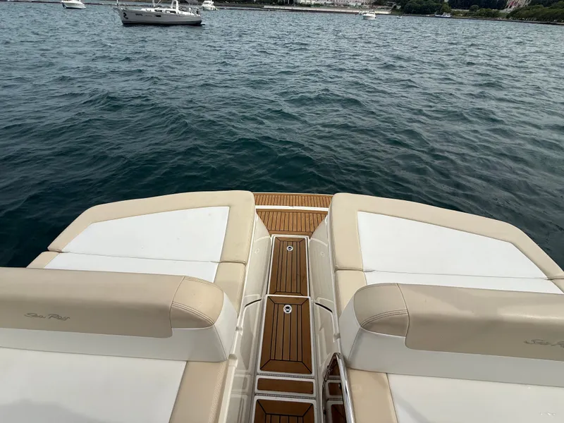Slide: The Image of The image shows the stern of a 2013 Sea Ray 370 Venture on the water. - 5