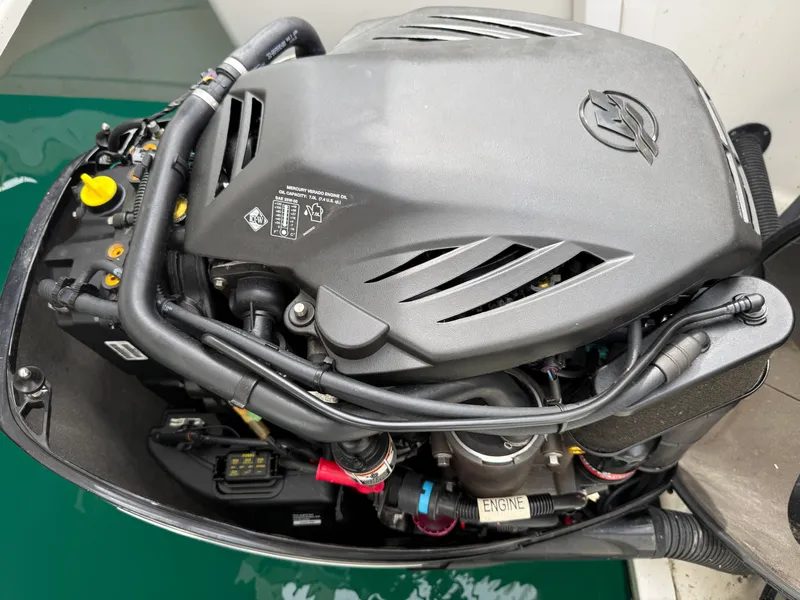 Slide: The Image of An engine of a 2013 Sea Ray 370 Venture, mounted in the water. - 29