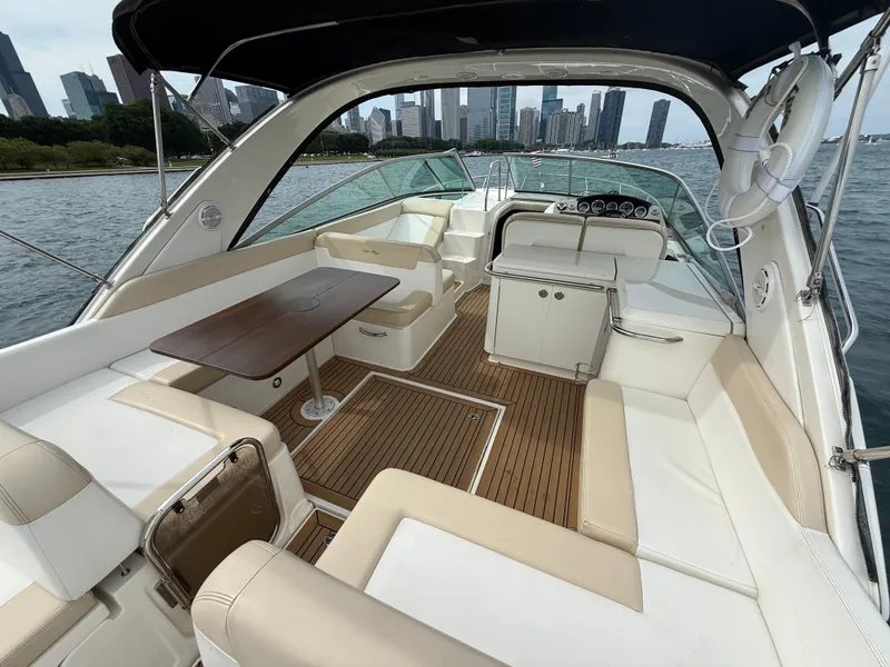Slide: The Image of The image shows the cockpit of a 2013 Sea Ray 370 Venture with a view of the skyline. - 7