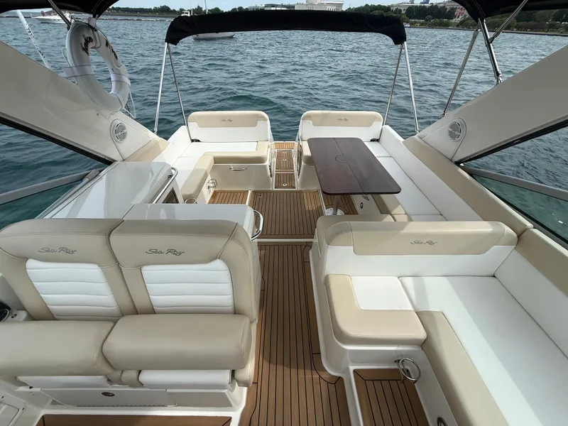 Slide: The Image of The image shows the cockpit of a 2013 Sea Ray 370 Venture with sleek seating and wood flooring. - 6