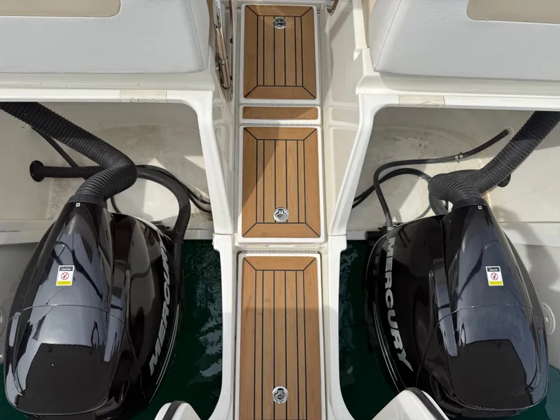 Slide: The Image of Two Mercury outboard engines are mounted on a Sea Ray 370 Venture boat. - 25