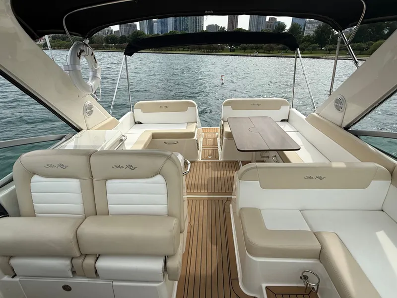 Slide: The Image of The image shows the cockpit of a 2013 Sea Ray 370 Venture with elegant seating and a table. - 8
