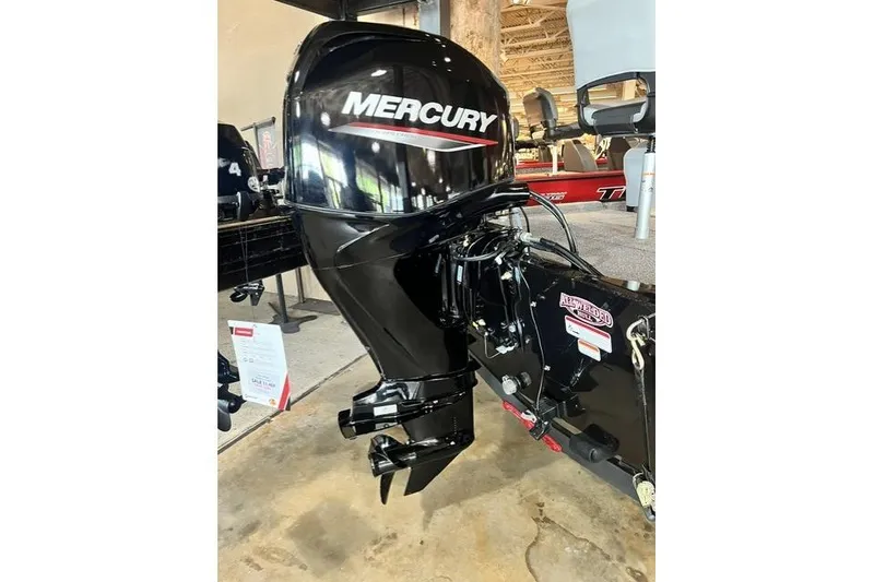 Slide: The Image of 2027 Tracker Bass Tracker Classic XL with Mercury outboard motor in showroom. - 12