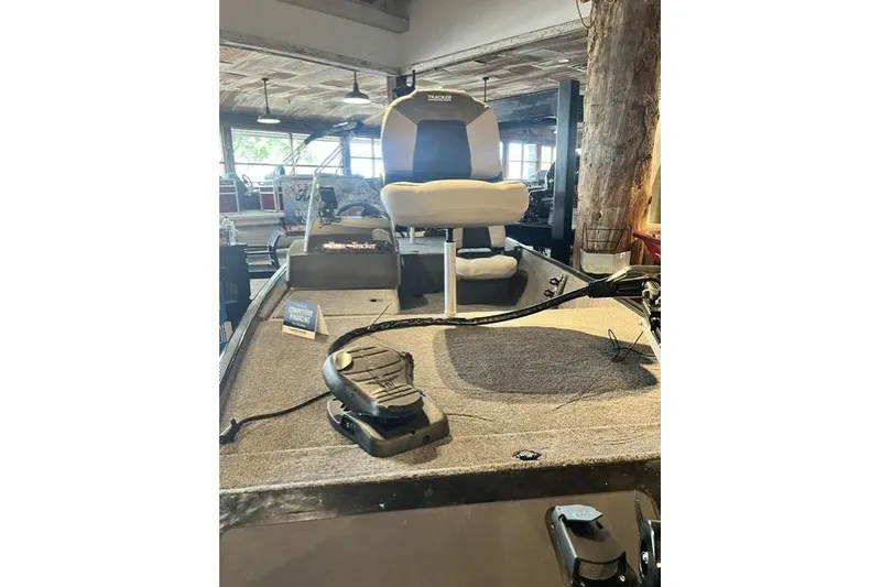 Slide: The Image of 2027 Tracker Bass Tracker Classic XL boat interior with seating and controls. - 7