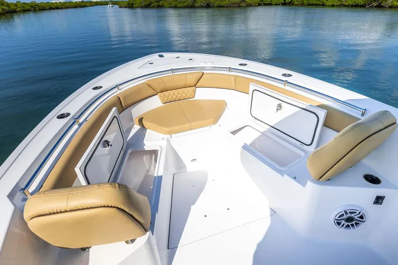 Slide: The Image of Manufacturer Provided Image: 2025 Sportsman Heritage 261 Center Console boat with tan seating and storage compartments. - 9