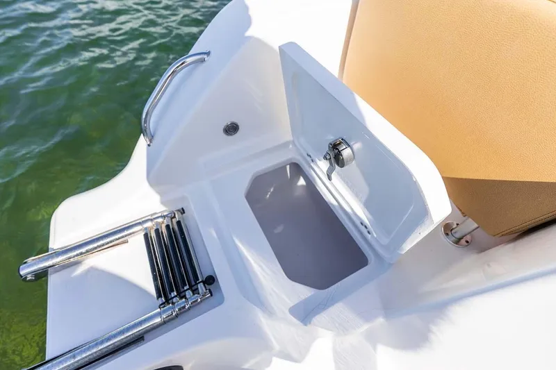 Slide: The Image of Manufacturer Provided Image: 2025 Sportsman Heritage 261 Center Console boat with open storage compartment and ladder. - 25