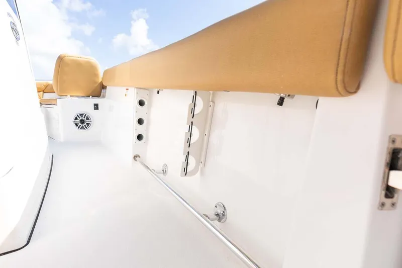 Slide: The Image of Manufacturer Provided Image: 2025 Sportsman Heritage 261 Center Console interior with tan seating and sleek white finish. - 22