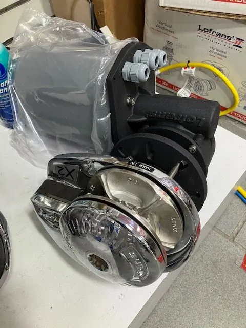 Slide: The Image of An electric anchor windlass with a shiny metal casing is placed on a table. - 23