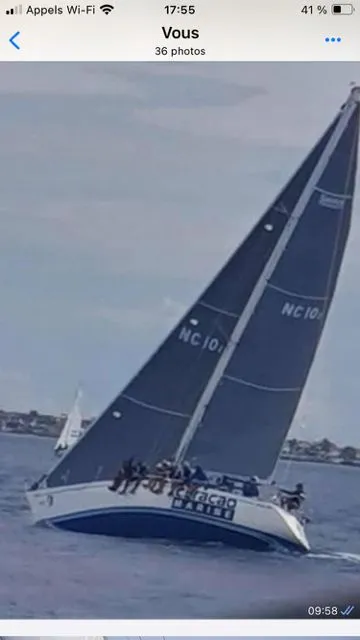 Slide: The Image of A 1979 Nautor Swan 441 sailing with a tilted mast on the water. - 2