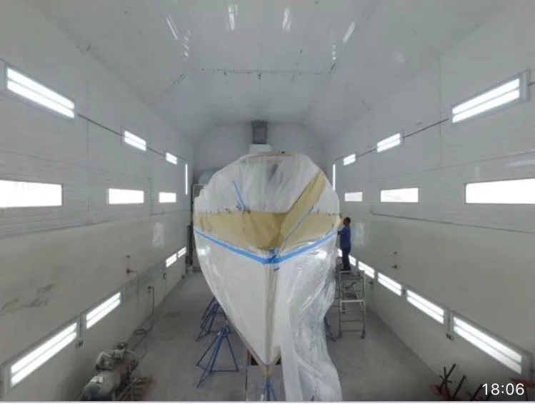Slide: The Image of A 1979 Nautor Swan 441 is being painted in a workshop. - 27
