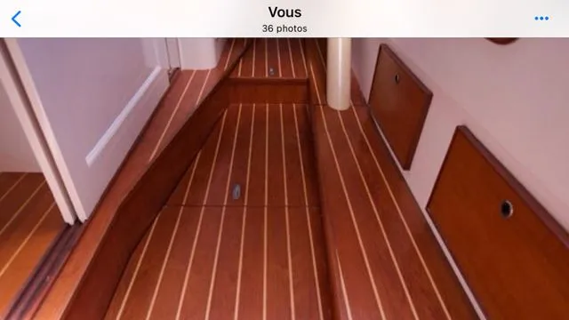 Slide: The Image of Interior of the 1979 Nautor Swan 441 with wooden flooring and steps. - 14