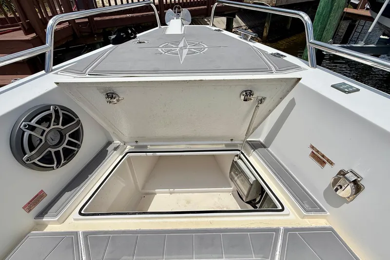 Slide: The Image of Open storage compartment on 2018 Axopar 37 Sports Cabin boat deck. - 31