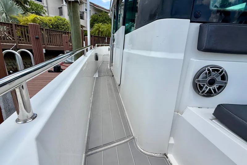 Slide: The Image of 2018 Axopar 37 Sports Cabin boat deck with sleek design and modern features. - 23