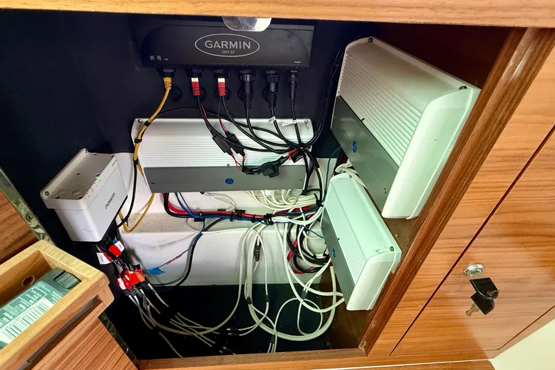 Slide: The Image of Electrical system inside 2018 Axopar 37 Sports Cabin with Garmin GPS and wiring components. - 41