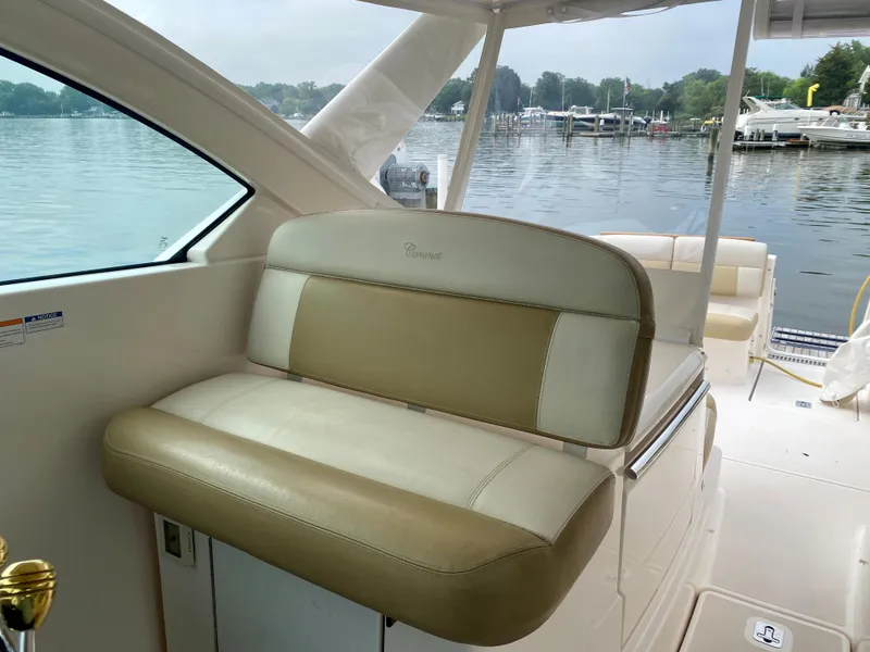 Slide: The Image of The 2012 Tiara Yachts 3100 Coronet features an elegant bench seat overlooking a calm harbor. - 15