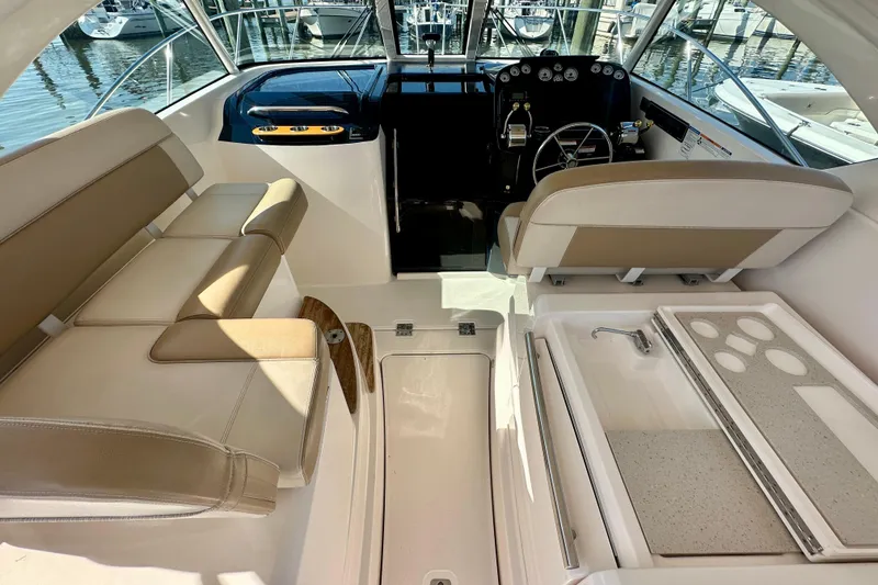 Slide: The Image of Interior of 2012 Tiara Yachts 3100 Coronet with seating and helm station. - 12