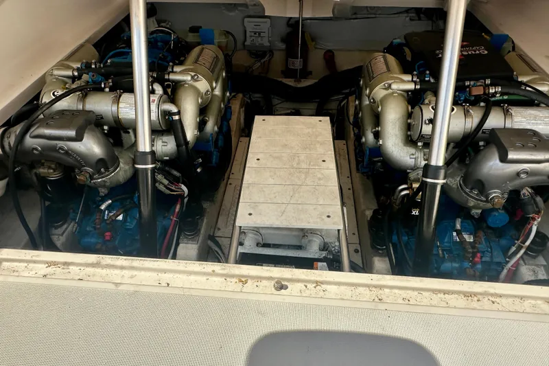 Slide: The Image of Engine compartment of a 2012 Tiara Yachts 3100 Coronet, showcasing dual engines. - 28