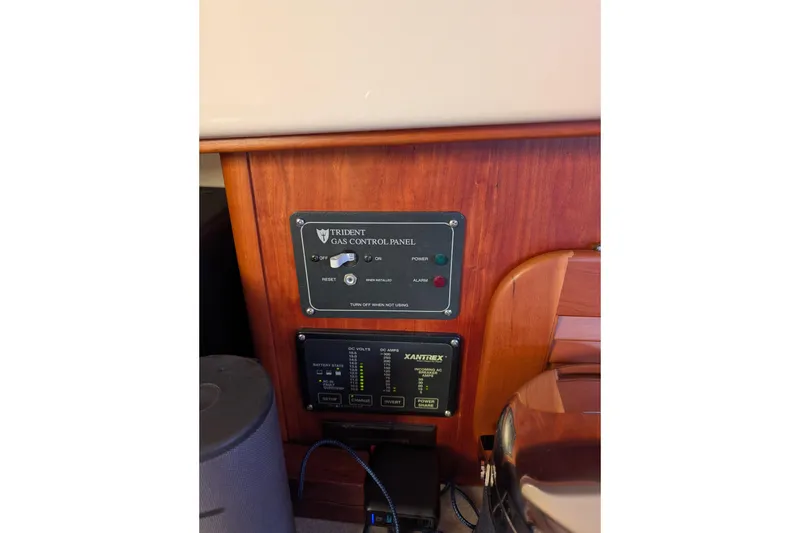 Slide: The Image of Control panel on 2003 Hinckley Picnic Boat 36 EP, featuring Trident gas and Xantrex systems. - 30