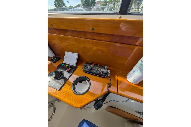 Slide: The Image of Helm controls of a 2003 Hinckley Picnic Boat 36 EP with polished wood finish. - 29