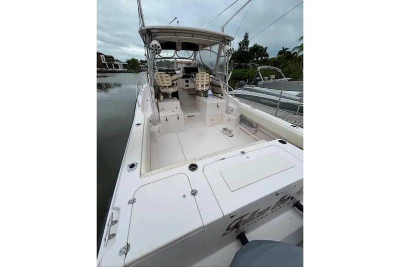Slide: The Image of 2004 Grady-White Marlin 300 boat interior, docked by calm waters. - 4