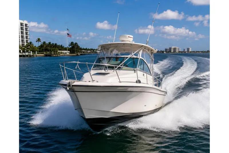 The Image of 2004 Grady-White Marlin 300 cruising on a sunny day, creating a dynamic water wake. - 0