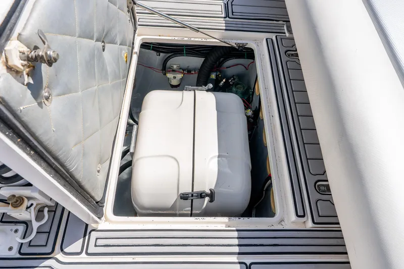 Slide: The Image of Open hatch revealing engine compartment of 2003 Intrepid 348 Walkaround boat. - 34