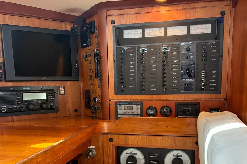 Slide: The Image of Control panel of a 1999 Sabre 452 yacht with navigation and communication equipment. - 32
