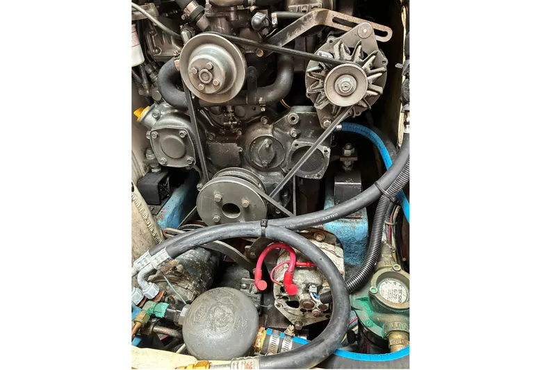 Slide: The Image of Engine of a 1999 Sabre 452, showcasing belts and components. - 50