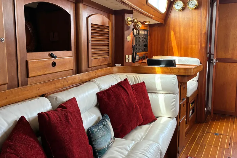 Slide: The Image of Luxurious 1999 Sabre 452 yacht interior with white leather seating and rich wood accents. - 34