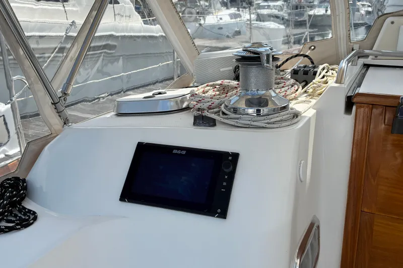 Slide: The Image of Cockpit of 1999 Sabre 452 sailboat with navigation equipment and winch. - 7