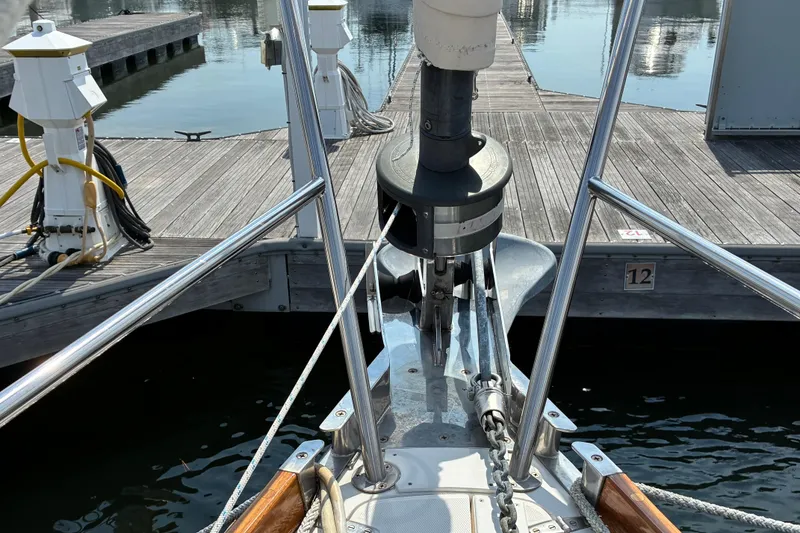 Slide: The Image of Bow of a 1999 Sabre 452 yacht docked at a marina. - 15
