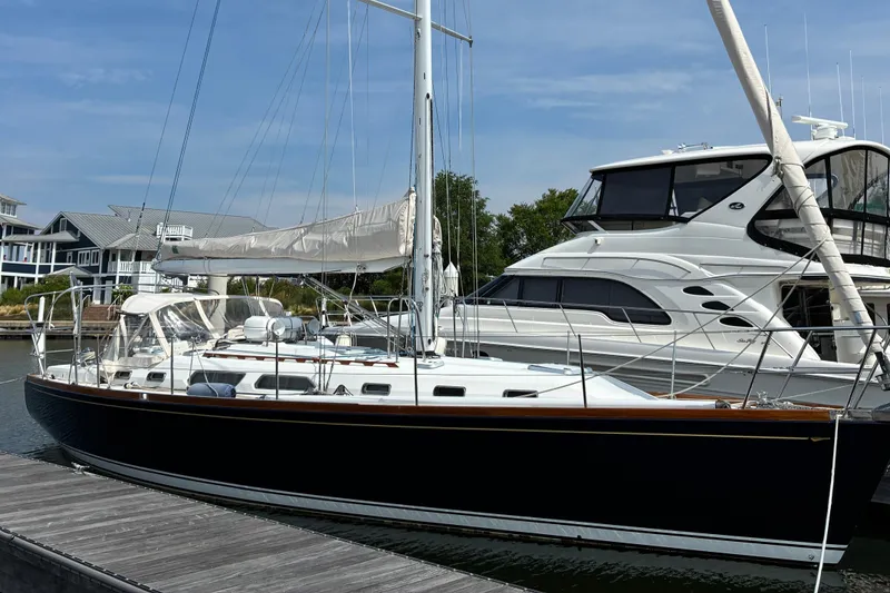 The Image of Sailboat docked at marina, Sabre 452, 1999 model, with neighboring yacht. - 0