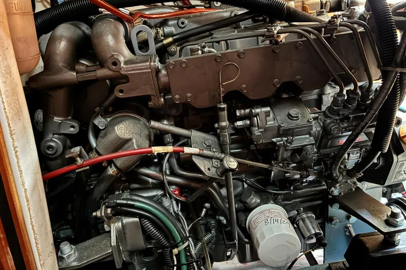 Slide: The Image of Close-up of a 1999 Sabre 452 engine with visible wiring and components. - 48