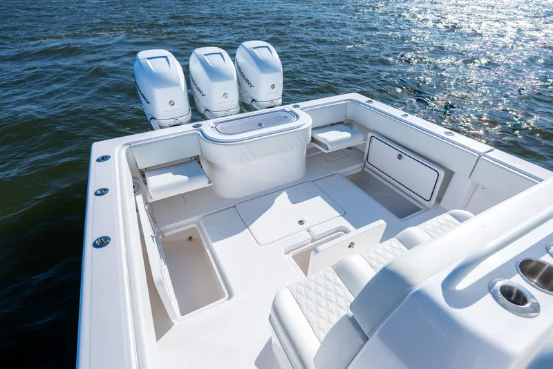 Slide: The Image of 2022 Invincible 39 Open Fisherman boat with triple outboard engines on open water. - 25