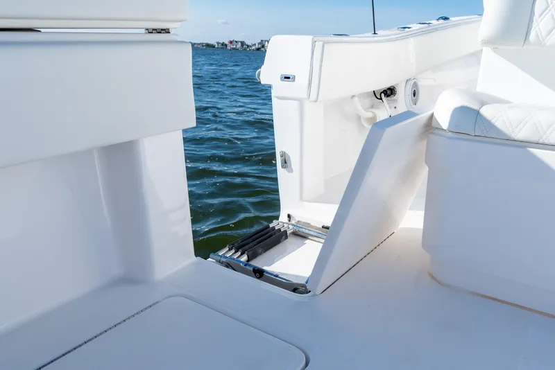 Slide: The Image of 2022 Invincible 39 Open Fisherman boat with open hatch, white interior, and ocean view. - 32