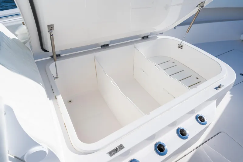 Slide: The Image of Open storage compartment on 2022 Invincible 39 Open Fisherman boat. - 13