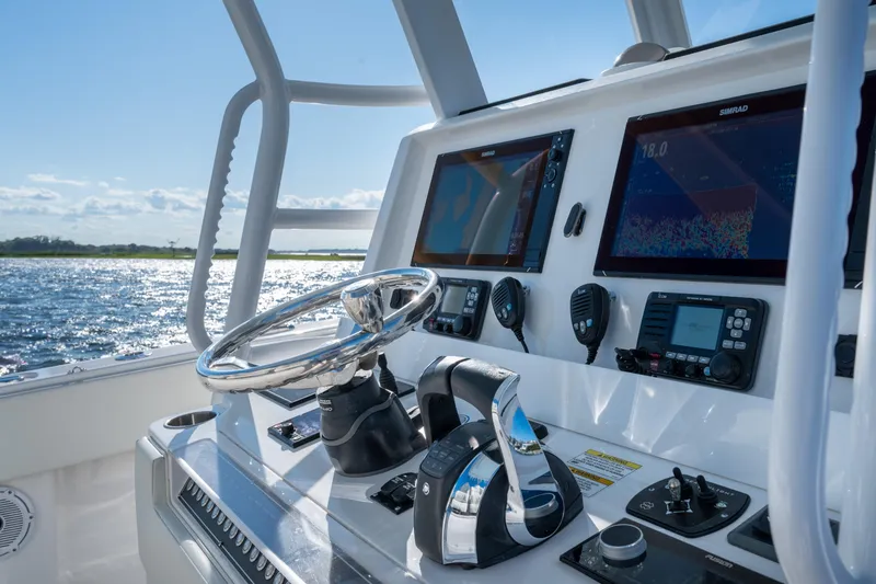 Slide: The Image of 2022 Invincible 39 Open Fisherman boat dashboard with advanced navigation systems. - 18