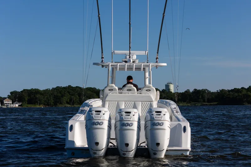 Slide: The Image of 2022 Invincible 39 Open Fisherman boat with quad 400 engines on open water. - 3