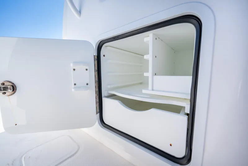 Slide: The Image of Open storage compartment on 2022 Invincible 39 Open Fisherman boat. - 22