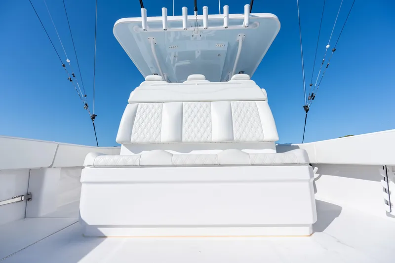 Slide: The Image of 2022 Invincible 39 Open Fisherman boat with white seating and blue sky background. - 28